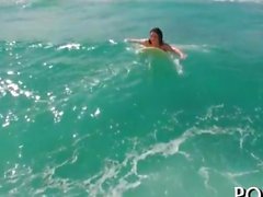 She is in the sea riding the waves