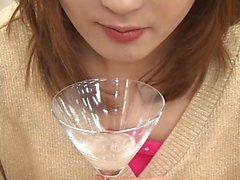 Two sexy Japanese girls spit in a glass and...