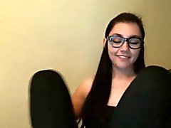 A cute brunette with glasses masturbating