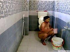 Chubby Indian Bhabhi taking bathroom after rough sex